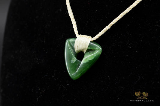 Möbius Strip pendant carved from kahurangi pounamu - nephrite jade - white cord necklace