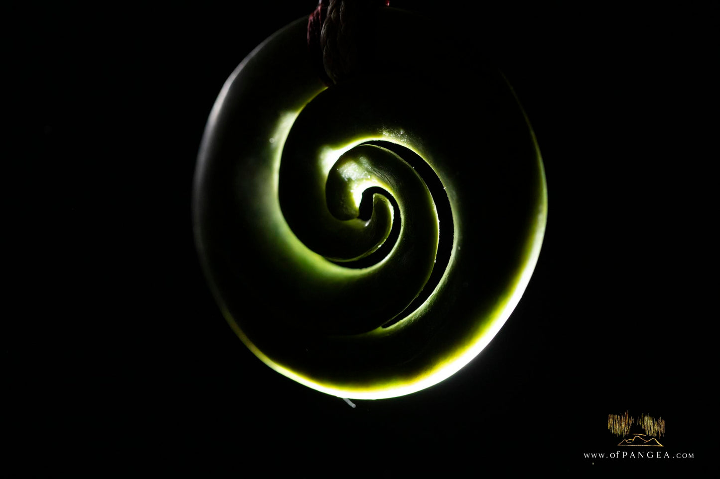 Double koru carved from nephrite jade kawakawa pounamu greenstone