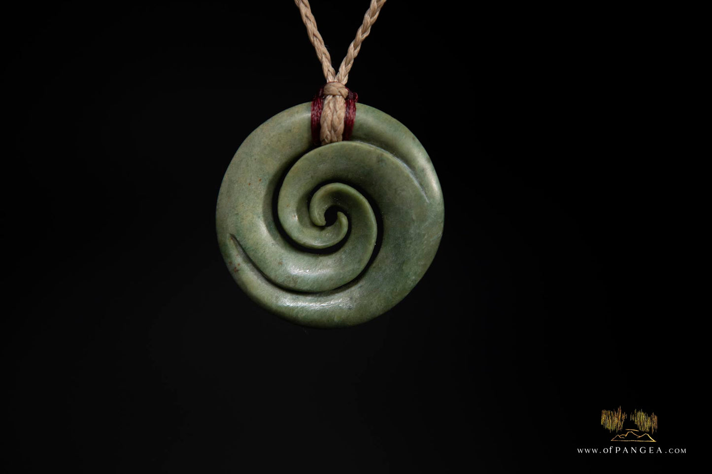 Double koru carved from nephrite jade kawakawa pounamu greenstone