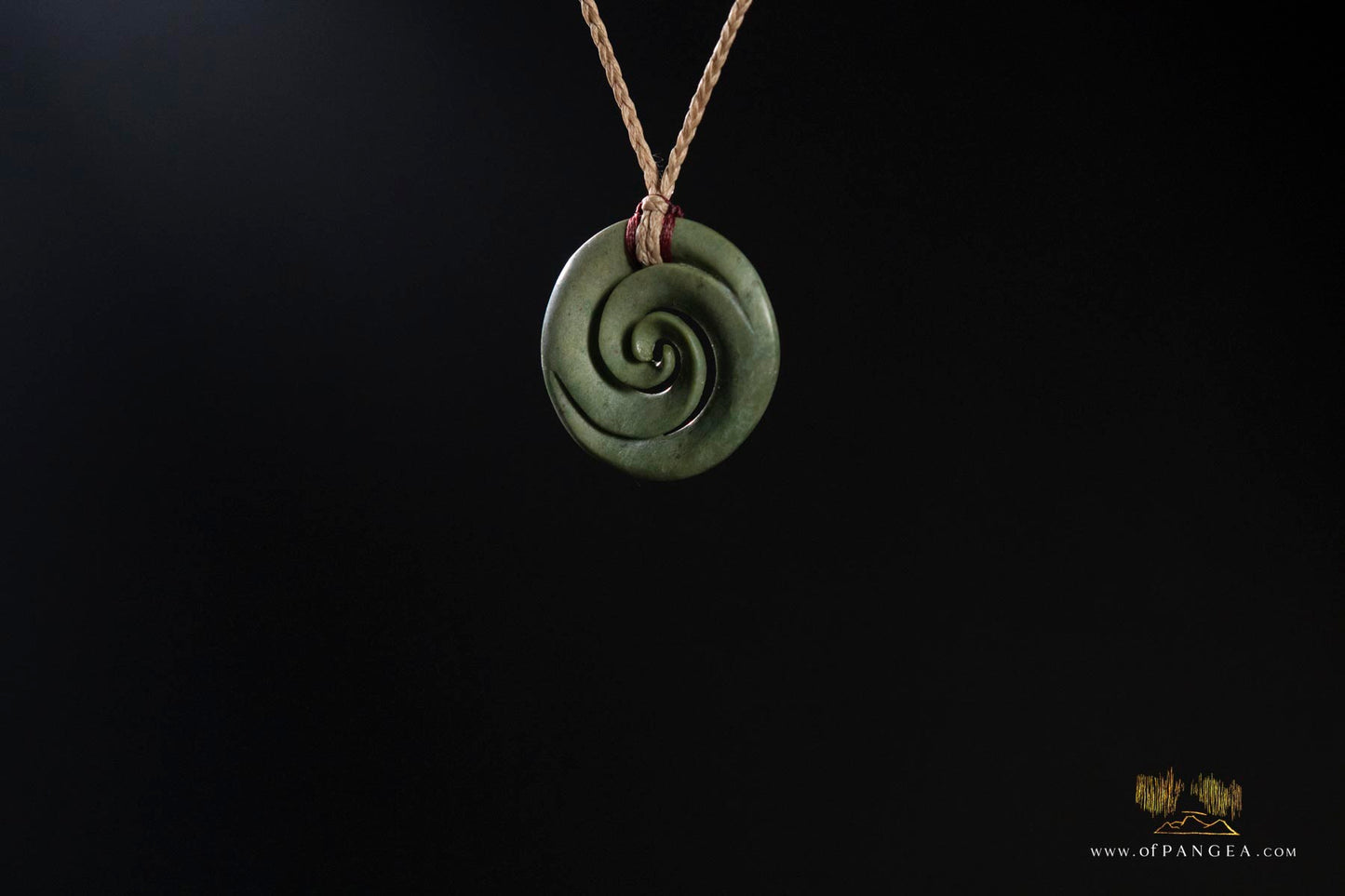 Double koru carved from nephrite jade kawakawa pounamu greenstone