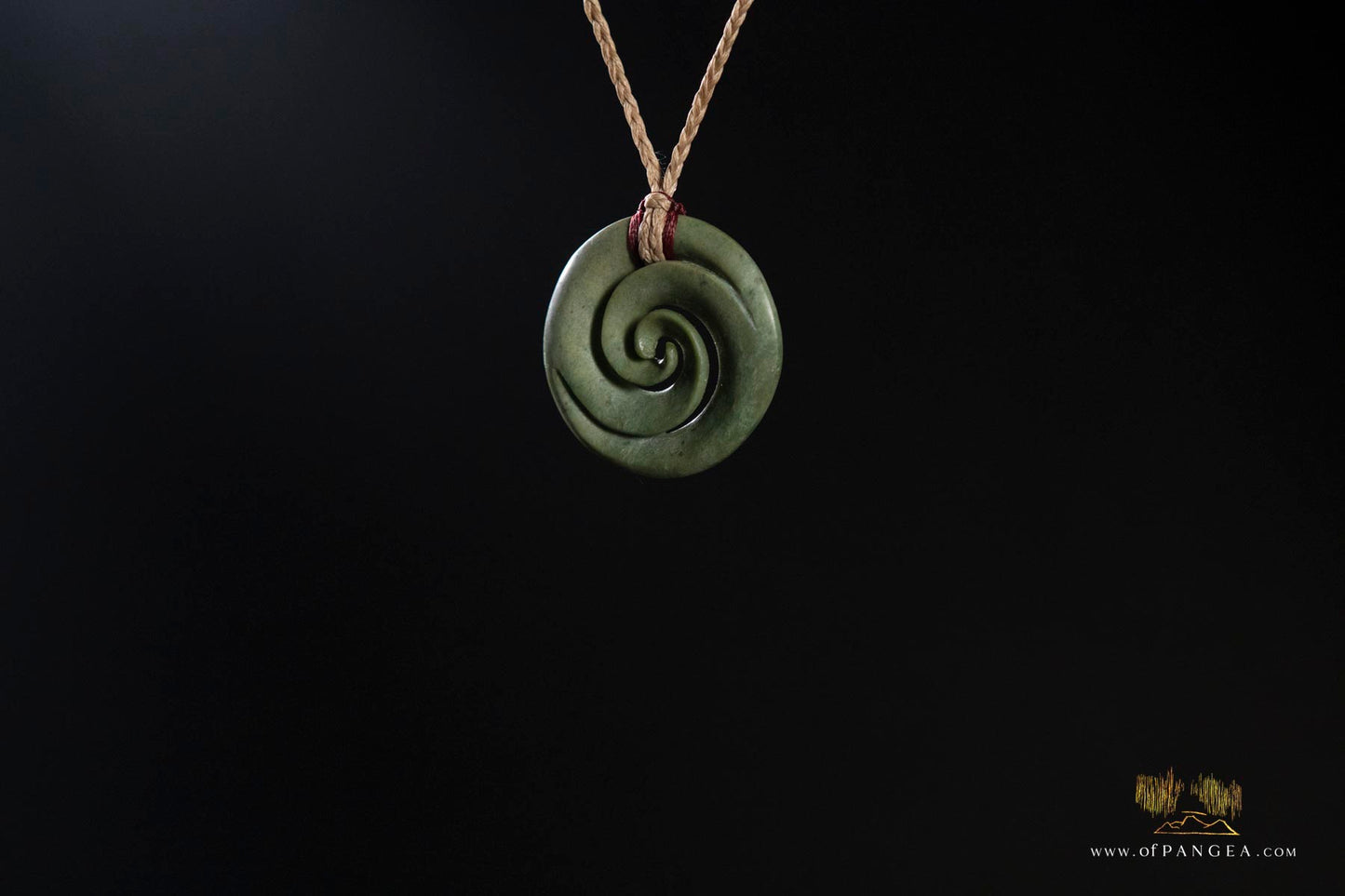 Double koru carved from nephrite jade kawakawa pounamu greenstone