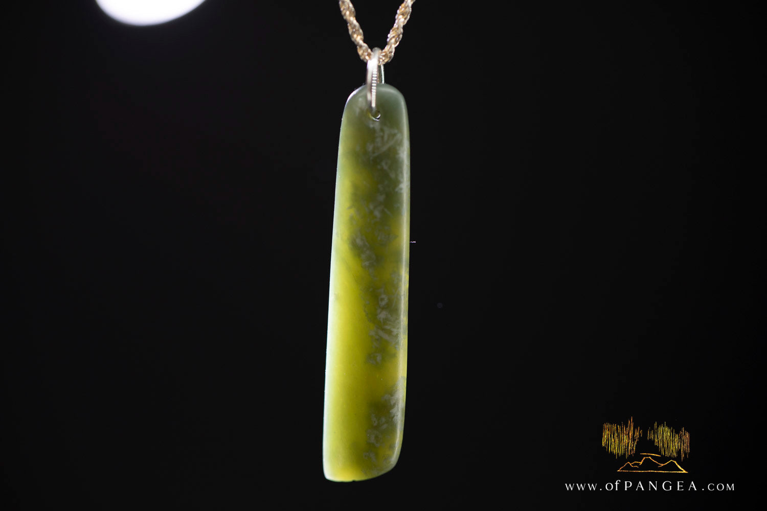 Close-up of cherry blossom jade toki showing translucent and green stone patterning — Wyoming nephrite
